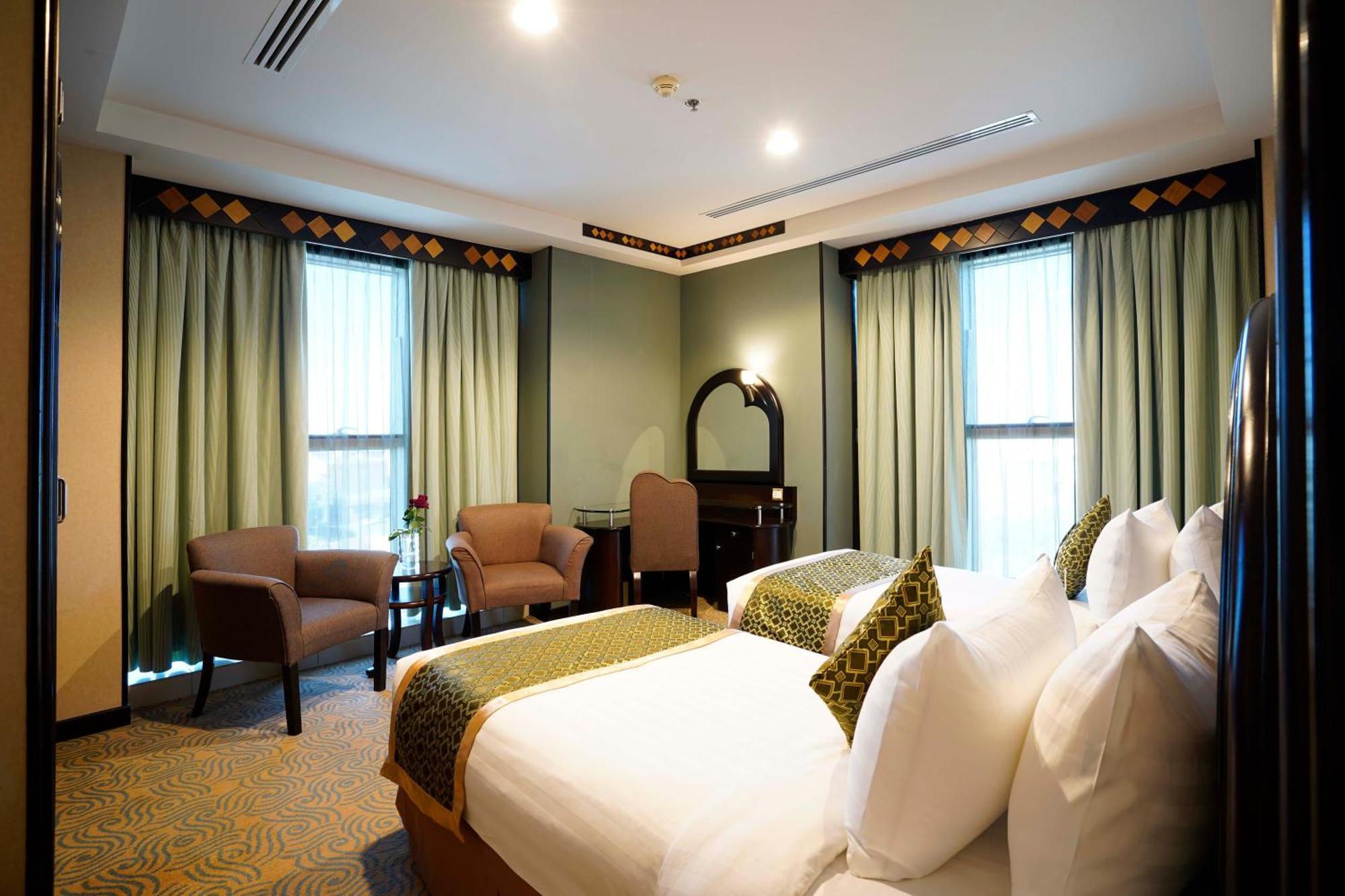 Awaliv International Hotel Ta'if Rum bild A bedroom at the hotel